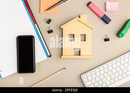 Work at home concept. Desk smart phone, keyboard and office supplies Stock Photo
