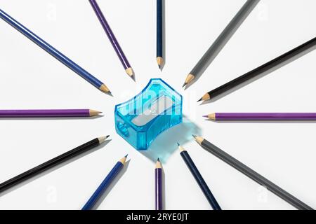Multicolored pencils and sharpener isolated on white background Stock Photo