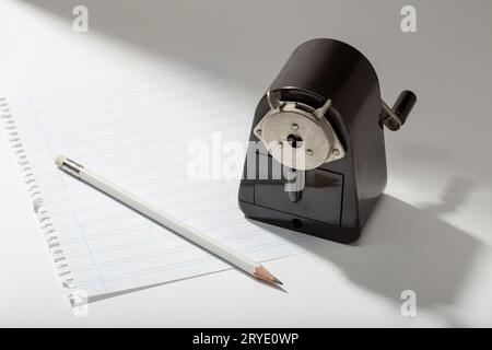 Pencil, blank sheet and vintage sharpener on table Stock Photo