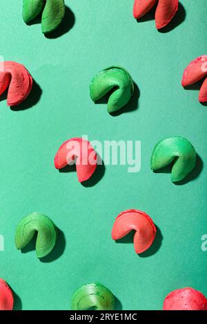 Green and red fortune cookies on color background Stock Photo