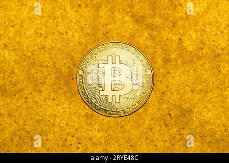 Bitcoin on golden sand Stock Photo