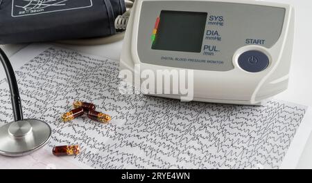 Blood pressure monitor with cardiogram Stock Photo