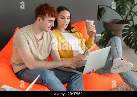 Young programmers working with laptop in office Stock Photo
