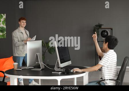 Male programmers working in office Stock Photo