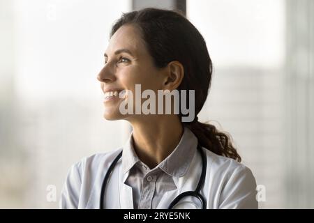 Happy pretty young doctor woman with stethoscope on her neck Stock Photo