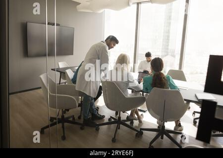 Clinic team of doctors discussing hospital work and business process Stock Photo