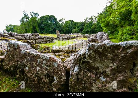 Stones at Remains of Din Lligwy, or Din Llugwy ancient village, Near Moelfre, Anglesey, North Wales, UK, landscape. Wide Angle. Stock Photo