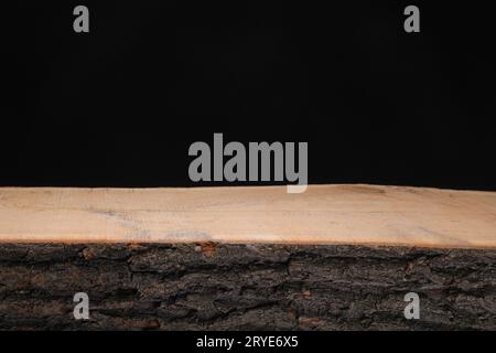 Slice of wood on a black background Stock Photo