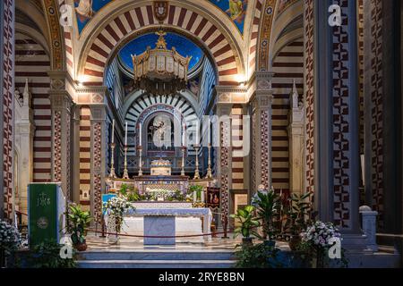 Cortona, Italy — Sept 10, 2023. A wide-angle photo of the main altar in the basilica of Saint Margaret of Corona. Stock Photo