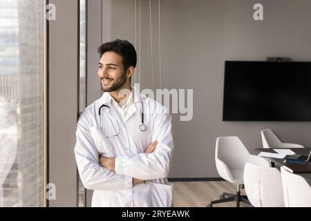 Happy handsome medical professional leader man standing alone Stock Photo