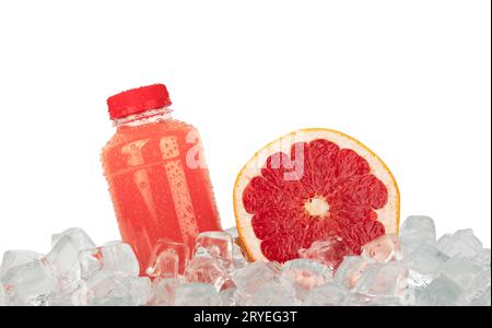 Fresh pink grapefruit juice and cut slice on ice Stock Photo