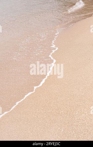 Soft beautiful sea wave on sandy beach Stock Photo