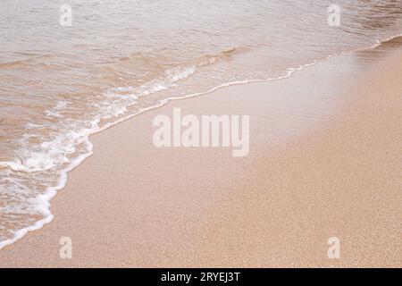 Soft beautiful sea wave on sandy beach Stock Photo