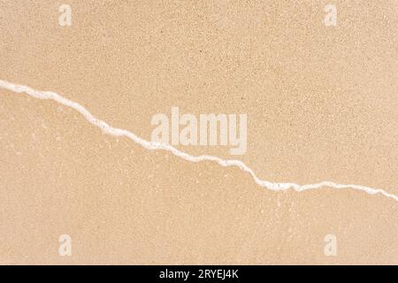 Soft beautiful sea wave on sandy beach Stock Photo