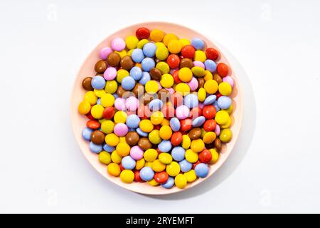 Multicolored Chocolate candy in plate Stock Photo