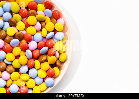 Multicolored Chocolate candy in plate Stock Photo