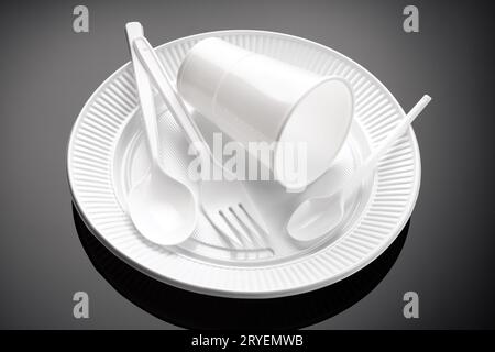 Plastic White cup, plate, fork and spoon Stock Photo
