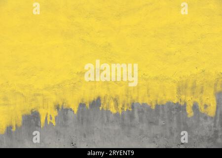 Weathered yellow painted gray concrete wall Stock Photo