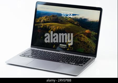 New York, USA - September 28, 2023: New MacOs Sonoma start up screen on Macbook Air laptop stand on white studio background Stock Photo