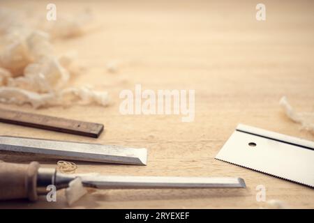 Carpentry or woodworking background with copy space. Carpentry tools and wood shavings on a table Stock Photo