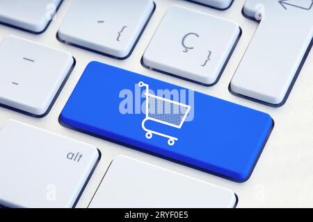 Online shopping, ecommerce, internet shopping concept. Shopping cart icon on blue keyboard key Stock Photo