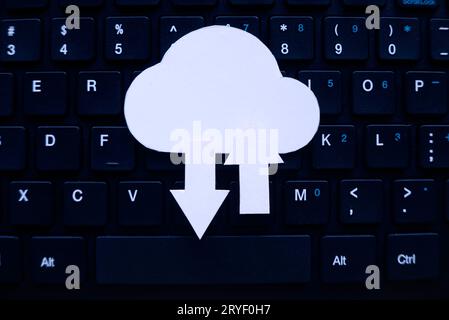 Cloud computing data storage concept.Network computing technologies. Digital server. Icon of cloud with arrow on computer keyboard. Stock Photo
