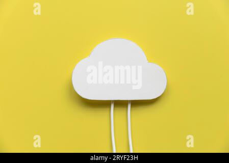 Cloud computing data storage concept.Network computing technologies. Digital server. Icon of cloud with white cables on yellow background. Stock Photo