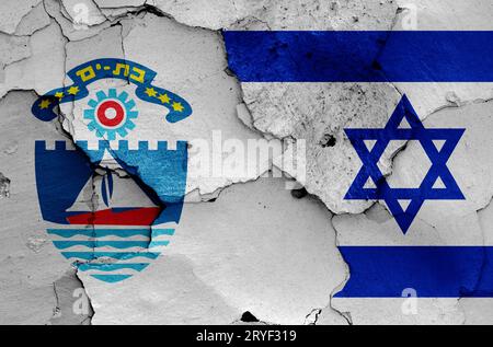 Flags of Bat Yam and Israel painted on cracked wall Stock Photo