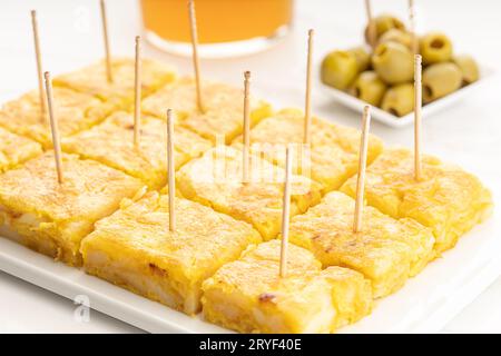 Spanish potato omelette appetizer called spanish tortilla on marble table Stock Photo