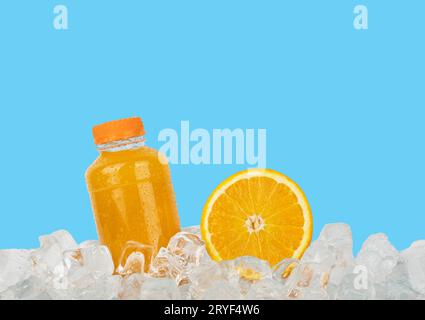 Fresh orange juice and cut slice on ice Stock Photo