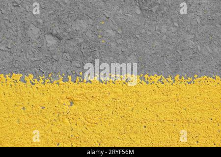 Weathered yellow painted gray concrete wall Stock Photo
