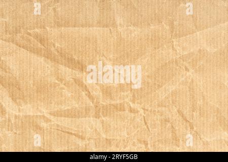 Crumpled Kraft paper texture background. Light brown color Stock Photo