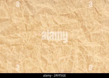 Crumpled Kraft paper texture background. Light brown color Stock Photo