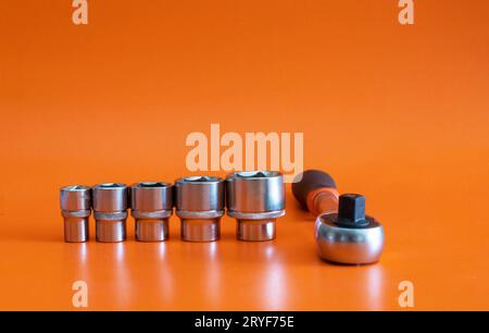 Set of wrenches, locks and ratchet wrenches on orange background. set of lock wrenches on orange background Stock Photo