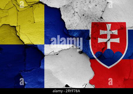 Flags of Bratislava Region and Slovakia painted on cracked wall Stock Photo