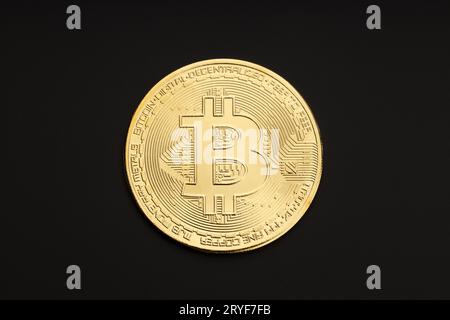 Bitcoin coin isolated on black background. Cryptocurrency. Top view Stock Photo