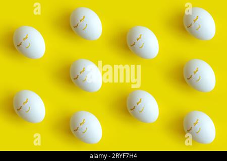 Easter eggs pattern on colorful yellow background. Top view, flatlay. Stock Photo
