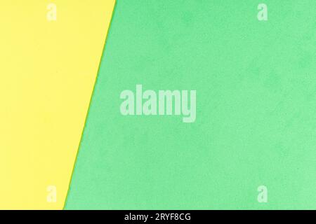 Yellow and green foam sheet with diagonal texture background. Full frame Stock Photo