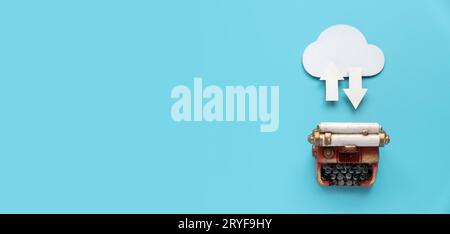 Cloud computing data storage concept.Network computing technologies. Digital server. Icon of cloud with arrow on blue background with miniature typewr Stock Photo