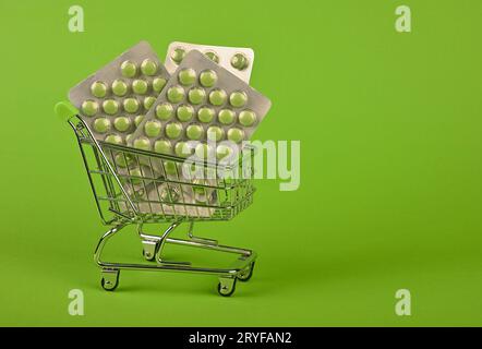 Several blister packs of pills in shopping cart Stock Photo