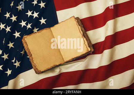 Open vintage book on old US American flag Stock Photo