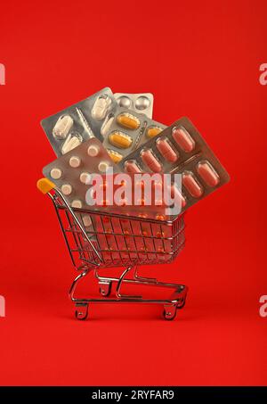 Several blister packs of pills in shopping cart Stock Photo