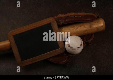 Baseball ball, wooden bat and vintage glove Stock Photo