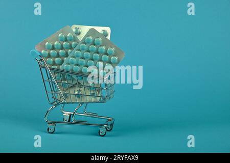 Several blister packs of pills in shopping cart Stock Photo