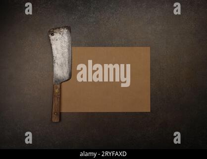 Vintage butcher meat cleaver and brown paper Stock Photo