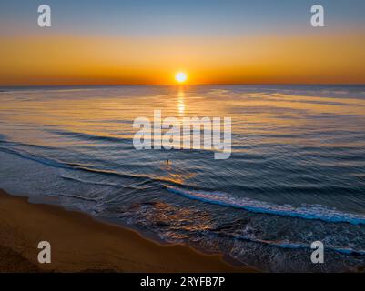 Sunrise seascape with clear skies at Shelly Beach on the Central Coast, NSW, Australia. Stock Photo