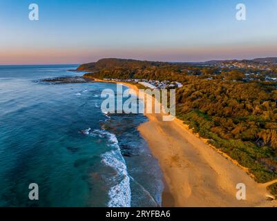 Sunrise seascape with clear skies at Shelly Beach on the Central Coast, NSW, Australia. Stock Photo