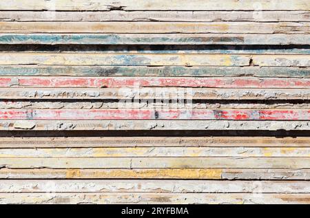 Grunge abstract wooden background. Colorful wood planks stacked used in construction industry Stock Photo