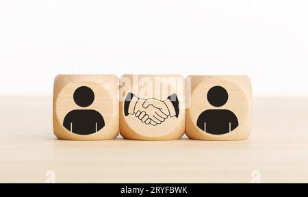 Wooden blocks with people icons in different colors. Building or ...