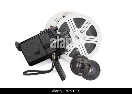 Super 8 camera and film reels isolated on white background. Copy space Stock Photo